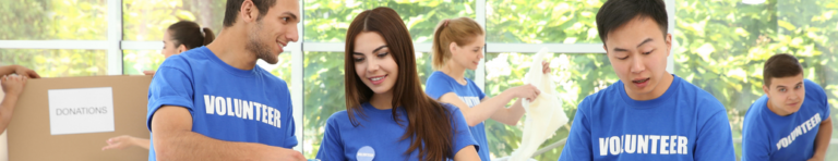 Diverse group of high school students volunteer at a donation collection.