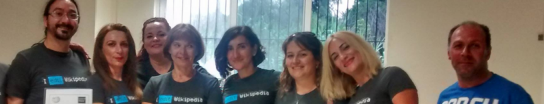 Diverse group of teachers wearing matching shirts