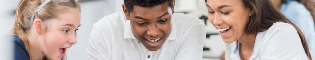 Three diverse middle school students display excited expressions in class.